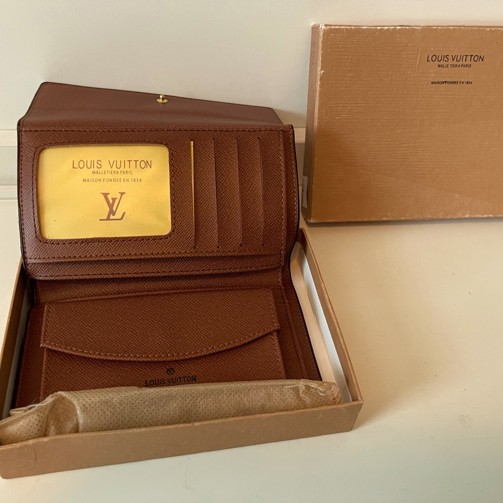 One Louis Vuitton wallet